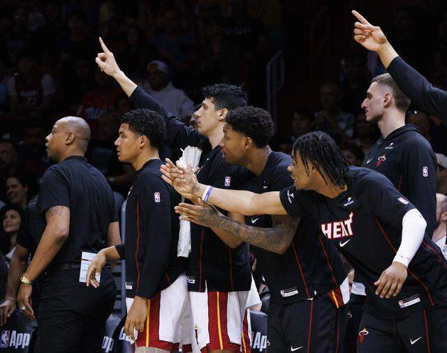 Miami Heat bench reacts to a call during the second half of a game against the Boston Celtics on Wednesday, April 1, 2026, at the Kaseya Center in downtown Miami, Fla.